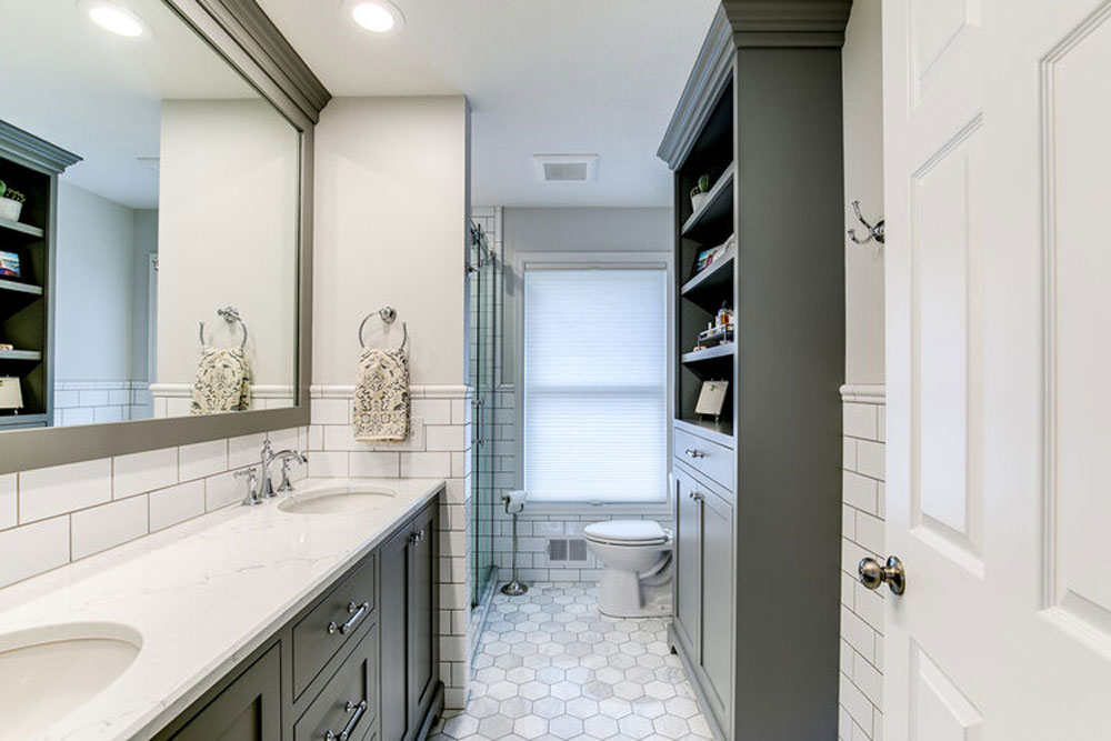 Double-sink vanity, mirror surround, & wall cupboard