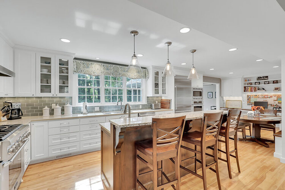 White cabinets/contrasting wood island w/seating