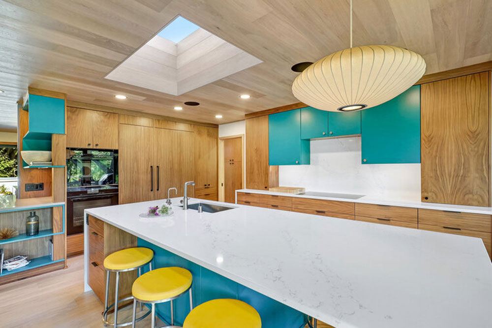 Wood cabinets w/contrasting teal island w/seating