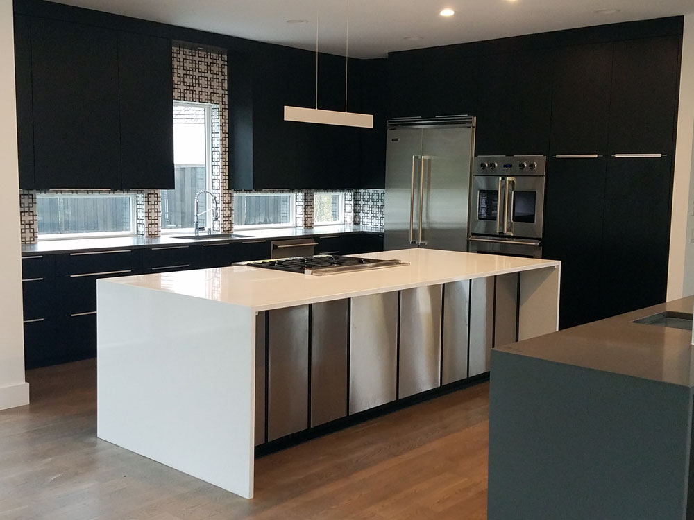 Black cabinets, white & stainless steel seated island