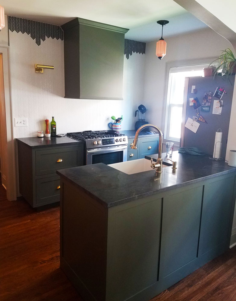 Small kitchen with green cabinets