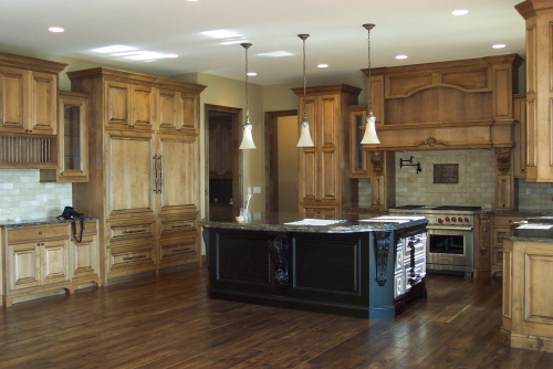 Two-tone wood cabinets and island