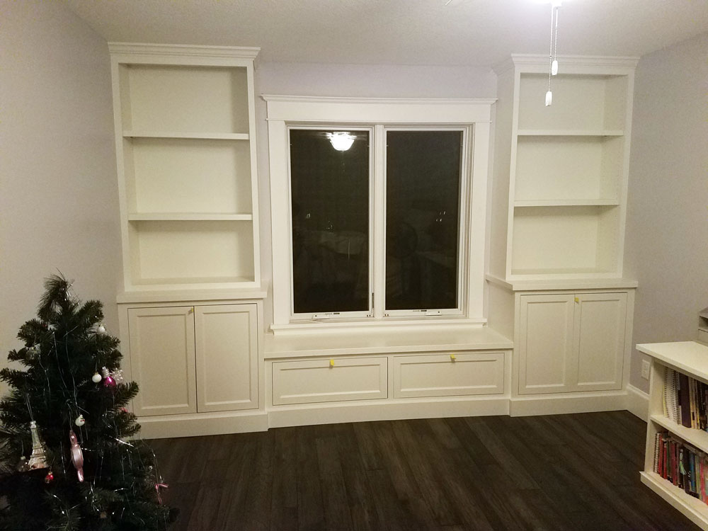 White window seat w/bookshelves & storage